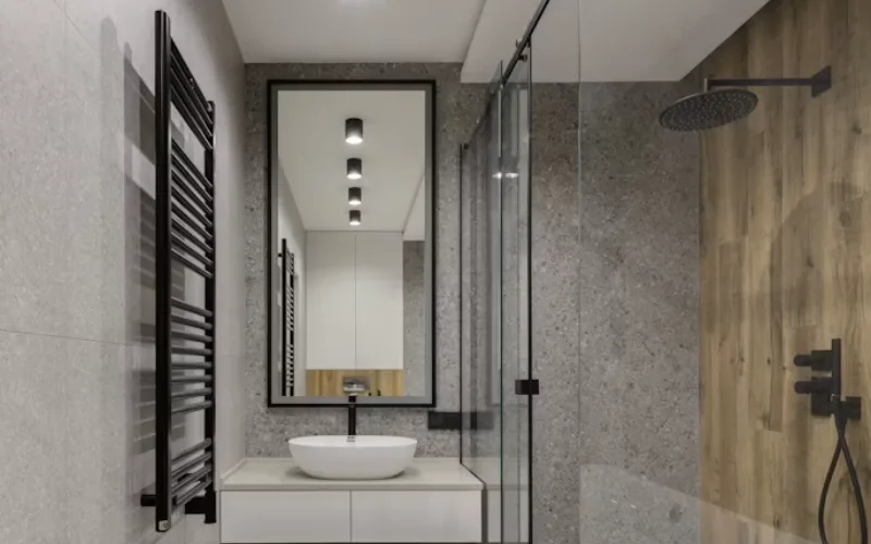 Modern bathroom with vessel sink vanity and glass shower.